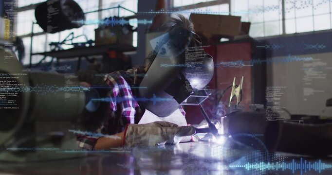Female welder bringing torch to seam, welding to join metal parts while blue HUD overlays growing