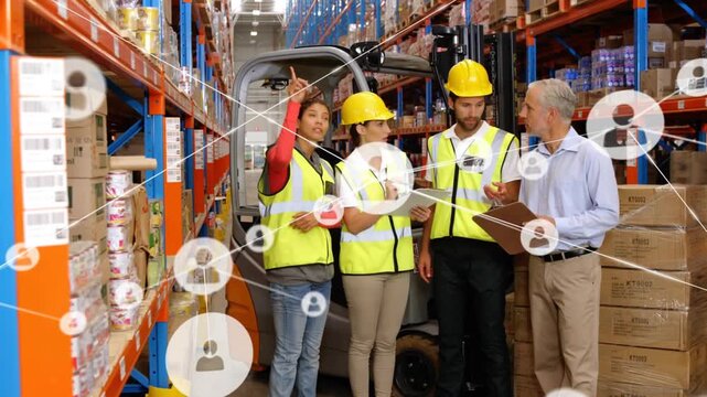 Warehouse team pointing at clipboard, causing network overlay growing across racks locating stock
