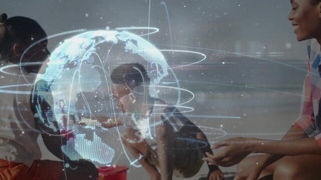 Tech globe rising on beach, woman watching, children digging and lifting shovel over globe for play