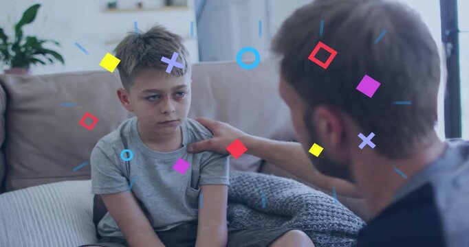 Vertical video: Man reaching to comfort boy on sofa during therapy, shapes appearing and obscuring