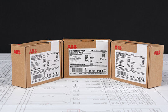 ABB equipment in cardboard packaging on an electronic digram during the assembly of the electrical control panel.