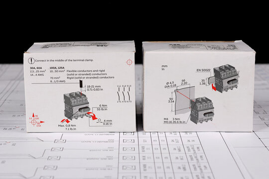 ABB equipment in cardboard packaging on an electronic digram during the assembly of the electrical control panel.