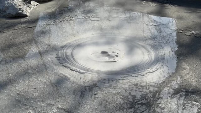 Bubbling Mud Pool with Circular Ripples at Oniishibozu Jigoku Geothermal Hot Spring Japan