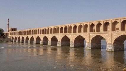 Fototapeta premium Long arched stone bridge spanning calm river composed multiple arches each distinct geometric pattern arranged symmetrical manner