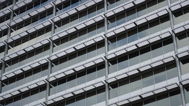 Modern office building facade with repeating windows urban architecture background