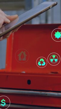 Vertical video: Tablet entering, hand swiping, eco icons gathering near red chest for monitoring