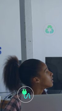 Tilting head on teal plug appearing, teen plaid gazing at desk-laptop as recycle icon appearing