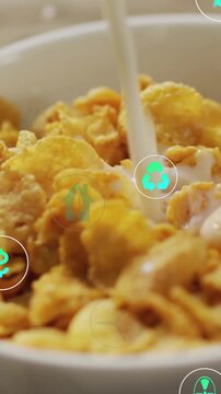 Vertical video: Teal icons appearing, milk stream pouring onto cornflake bowl, showing eco benefits