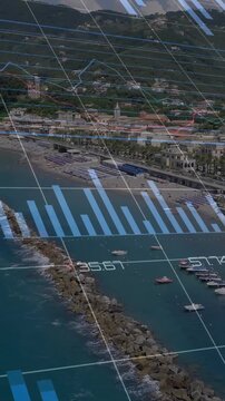 Vertical video: camera starting pan, data overlays animating over harbor, bars moving, showing data