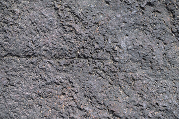 無機質な黒い岩肌や溶岩の質感を捉えた重厚感のあるテクスチャ背景