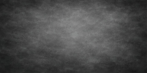 Obraz premium A dark vintage grunge background featuring a textured black and white stone wall with a weathered grey paper pattern for a blank dirty chalkboard design