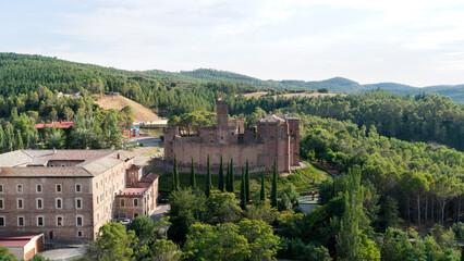 Obraz premium Javier Castle, a medieval fortress, showing historic architecture and stone walls surrounded by lush green forests in Navarre, Spain