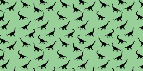 Seamless dinosaur pattern with brachiosaurus silhouettes. Prehistoric animal repeating background suitable for kids' wallpaper, nursery decor, textile print, and wrapping paper. © andrcnz