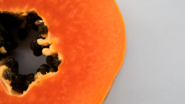 The main benefits of papaya fruit are that it is rich in fiber and the enzyme papain which helps break down protein, prevents constipation, bloating, and relieves heartburn.