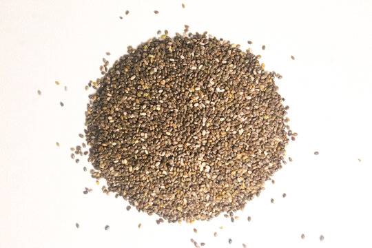 raw chia seeds isolated on white background