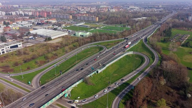Highway Intersection: A high-angle perspective showcasing a complex highway intersection, weaving through the urban landscape with multiple lanes and cloverleaf exchanges.