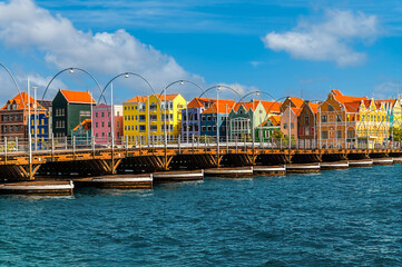 Fototapeta premium A view across the Queen Emma Bridge towards Handelskade in the Punda District in Willemstad, Curacao on a bright morning