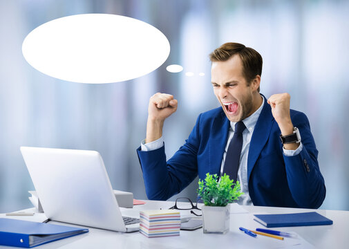 Expressive happy businessman suit, work use laptop at office. Business man raise hands up with clenching fists - success concept. White empty think speech bubble speechbubble thinkbubble, free space
