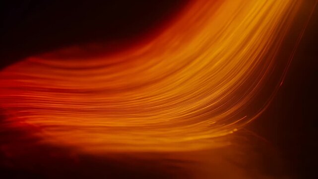 Abstract flow of fiery red and golden light creating textured waves