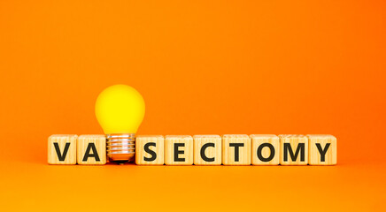 Vasectomy word symbol. Concept word Vasectomy on beautiful wooden blocks. Beautiful orange...