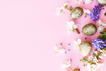 Easter flat lay. Stylish easter eggs and cherry flowers on pink background. Easter celebration, season greetings mockup. Spring modern floral banner © sonyachny