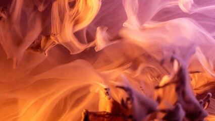 Fiery tendrils swirl in warm hues of amber and violet