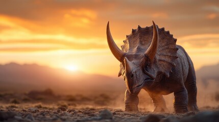 Fototapeta premium A majestic Triceratops dinosaur stands poised against a breathtaking natural landscape during sunrise, embodying strength and resilience in a prehistoric setting filled with wonder.