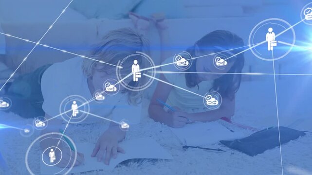 Animation of network of connections with icons over diverse schoolchildren writing