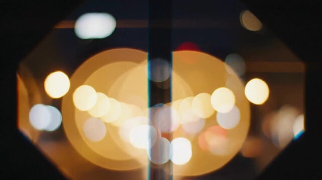 Abstract bokeh lights reflecting in an octagonal frame creating a vibrant urban night atmosphere perfect for backgrounds or overlays