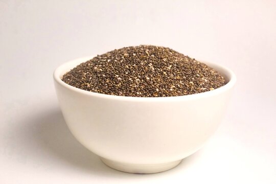 bowl of chia seeds isolated on white background