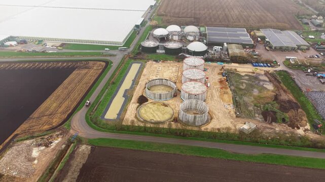 Aerial drone view of a commercial glasshouse and adjacent biogas renewable energy plant in Cambridgeshire, UK