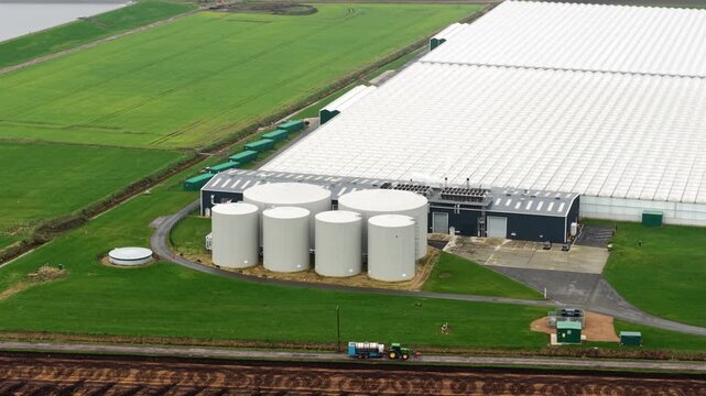 Drone shot of a biogas energy hub and horticultural plant near Cambridge, capturing the scale of modern UK agri-tech.