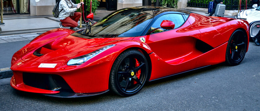 Ferrari LaFerrari (Ferrari F70) parked in a street in Paris, april 2015 18th. Producted since 2013, there is 500 copies in the world. You can also see a Bugatti Veyron behind.