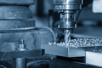 Precision boring operation on a metal plate using a CNC milling machine equipped with a flat nose...