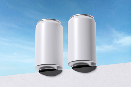 Two white drink can on top of the wall with sky background for mockup template