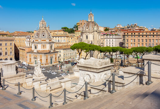 Architecture of Venice square (Piazza Venezia) with Vittoriano monument, churches and Trajan column, Rome, Italy