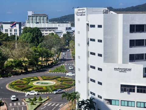 SONGKHLA, THAILAND - MAR 5, 2024 : Building of the Faculty of Dentistry Prince of Songkla University at Prince of Songkla University Hat Yai campus with campus road and roundabout in Songkhla province