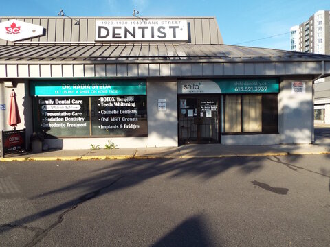 Ottawa, Ontario, Canada-July 18, 2025: The storefront for "Shifa Dentistry" at 1-1940 Bank St.