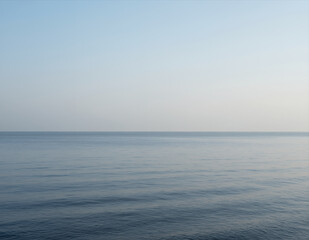 Obraz premium Serene Ocean Horizon with Calm Water and Soft Gradient Sky Perfect for Travel Backgrounds or Minimalist Design Projects