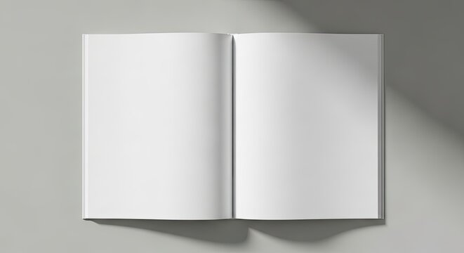 Open blank spread book flat lay on muted gray background, mockup design concept
