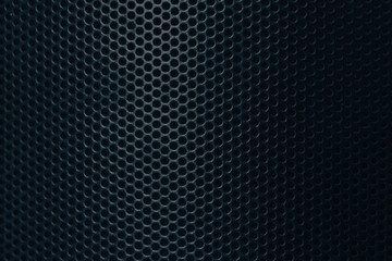 Obraz premium Close-up of Black Perforated Metal Mesh Texture Background,A high-detail, macro shot of a black metallic speaker grille or industrial perforated metal sheet. The image features a repetitive circular.