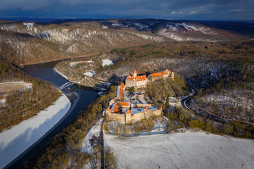 Beautiful old castle - top view from a drone. Winter landscape at sunset. Veveri Castle - City of Brno - Czech Republic - Europe.