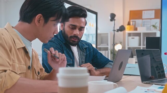 Business team in office meeting, reviewing documents and brainstorming innovative ideas for a new business venture and strategy.