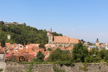 Fototapeta premium Black Church Brasov Romania August 2024 Historic gothic cathedral above red city roofs