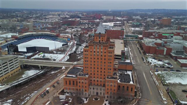 Drone pullback from Mayflower Manor Apartments revealing Akron skyline