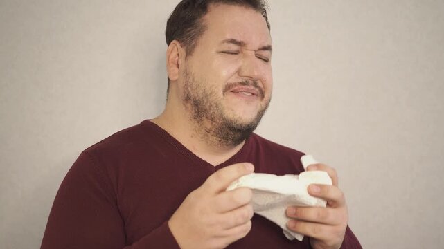Guy feeling cold at home with home heating trouble