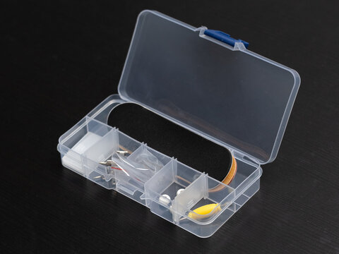 Toolbox containing fingerboard toy skateboard parts with tools.