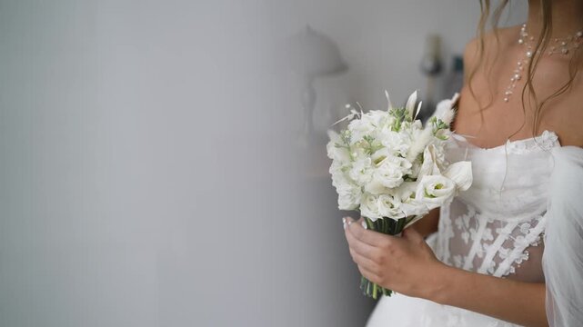 Elegant Bride Holding White and Green Floral Bouquet with Calla Lilies and Dahlias