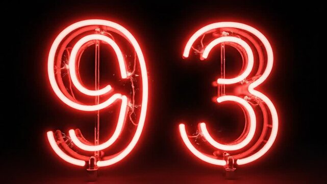 Red Neon Sign Glowing in the Dark Displaying the Number 93 on Black Background