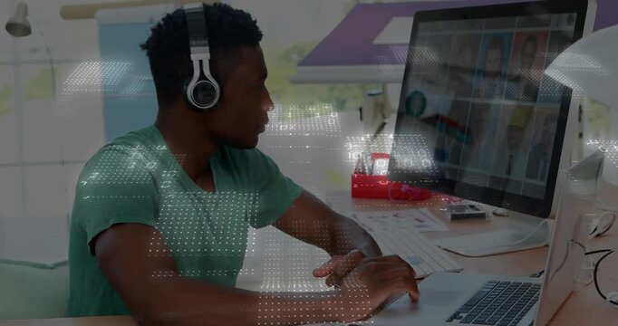 Male designer typing, lifting headphones, matching swatches while animated overlays syncing samples